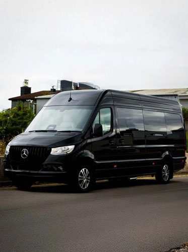 HotWheelz executive van parked outside building